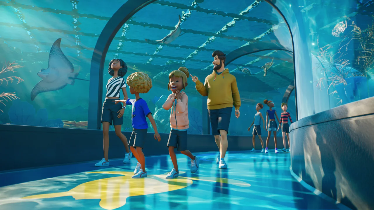 Visitors walking through a blue aquarium viewing tunnel